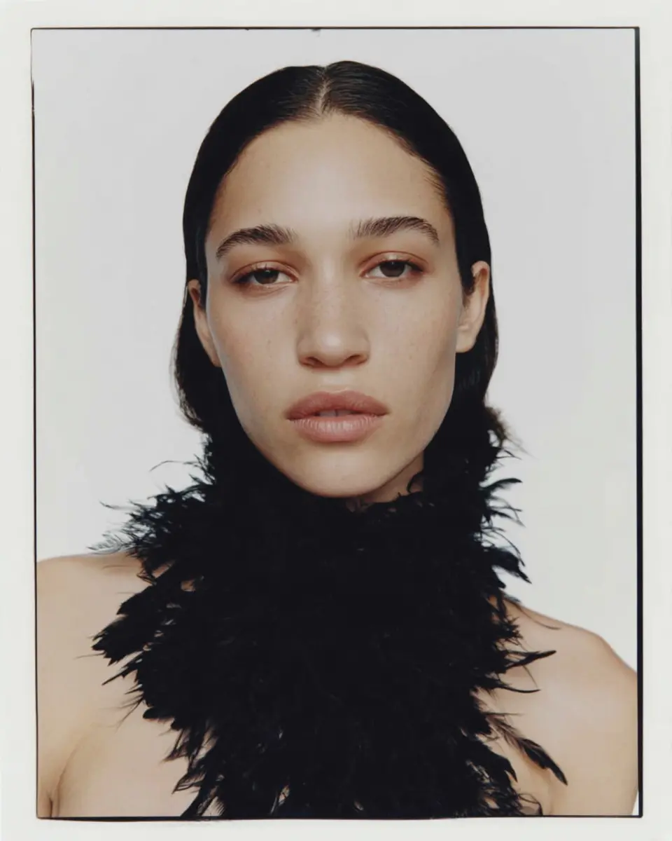 AI-generated feather collar fashion portrait visual created by Officine AI