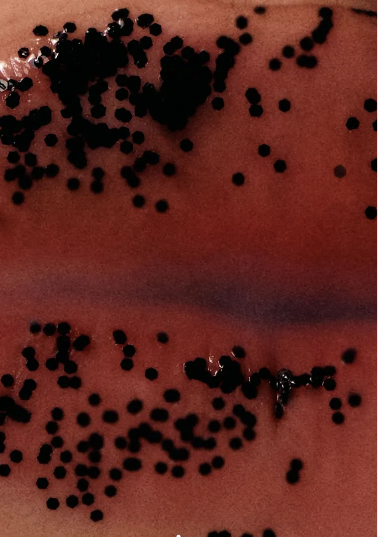 AI-generated red fruit texture still life visual created by Officine AI